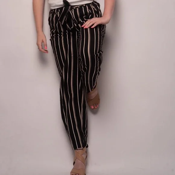 Black and white stripped pants that tie with a matching “belt”. - Picture 2 of 2